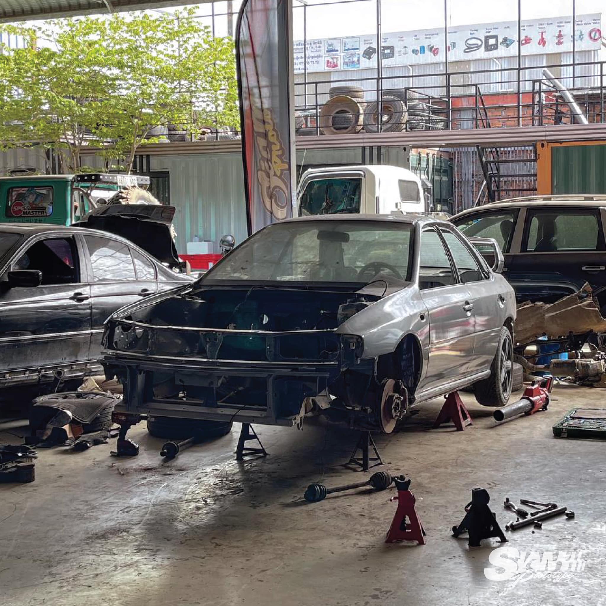 Subaru Impreza GC8 stripped and on jack stands