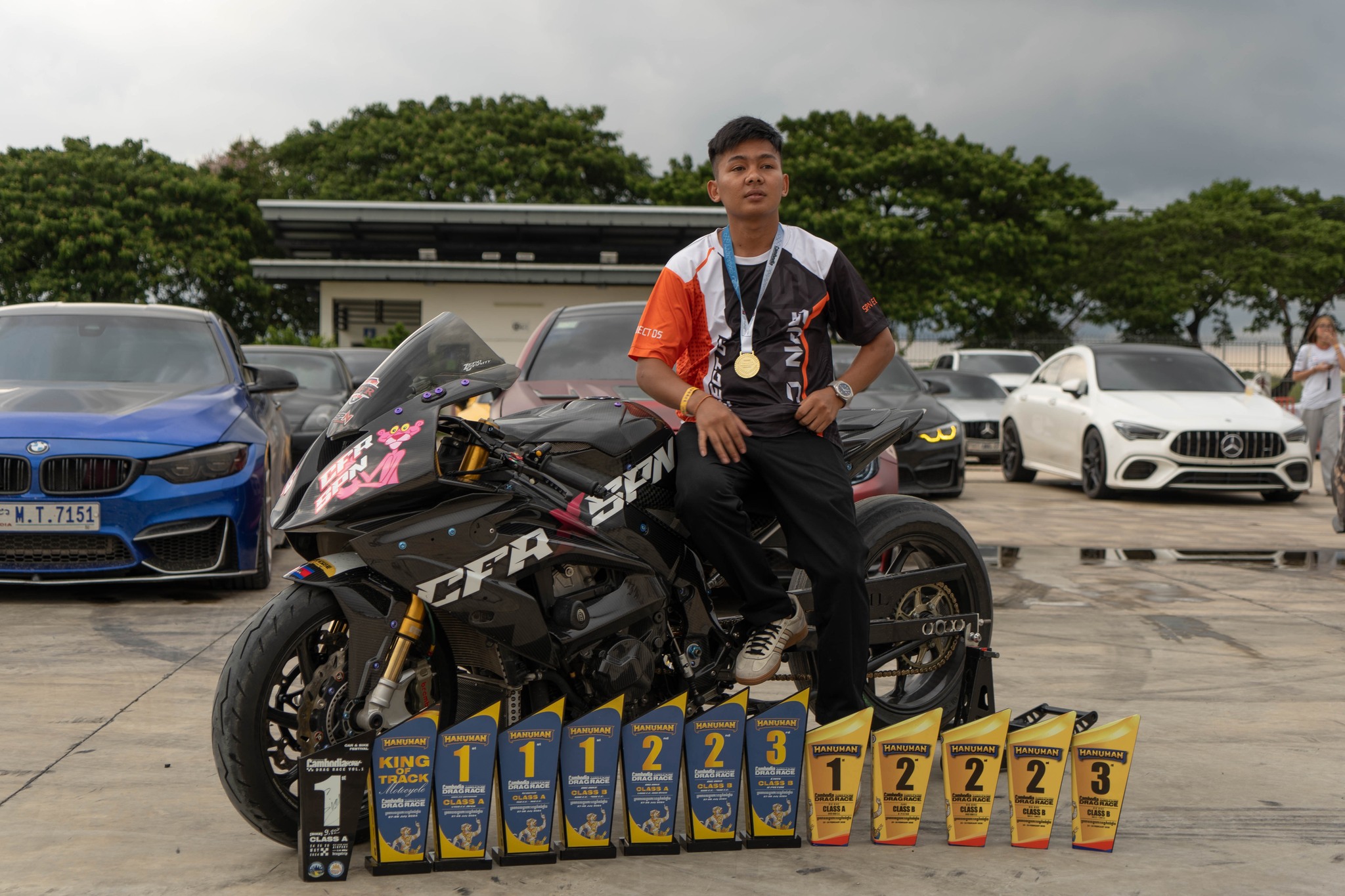 Stunt rider with collection of trophies