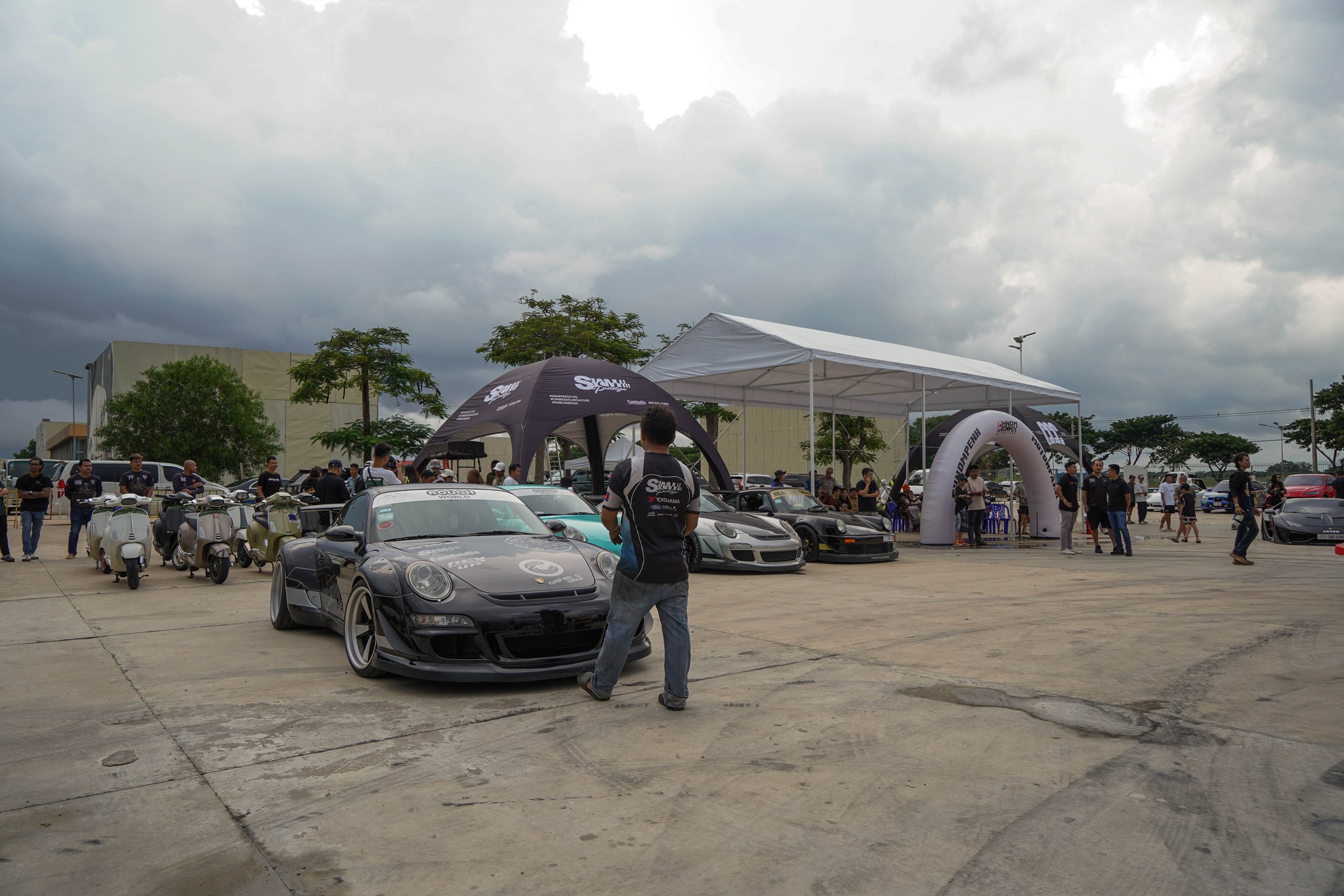 Phnom Penh Motor Park event area with SPC tent and cars