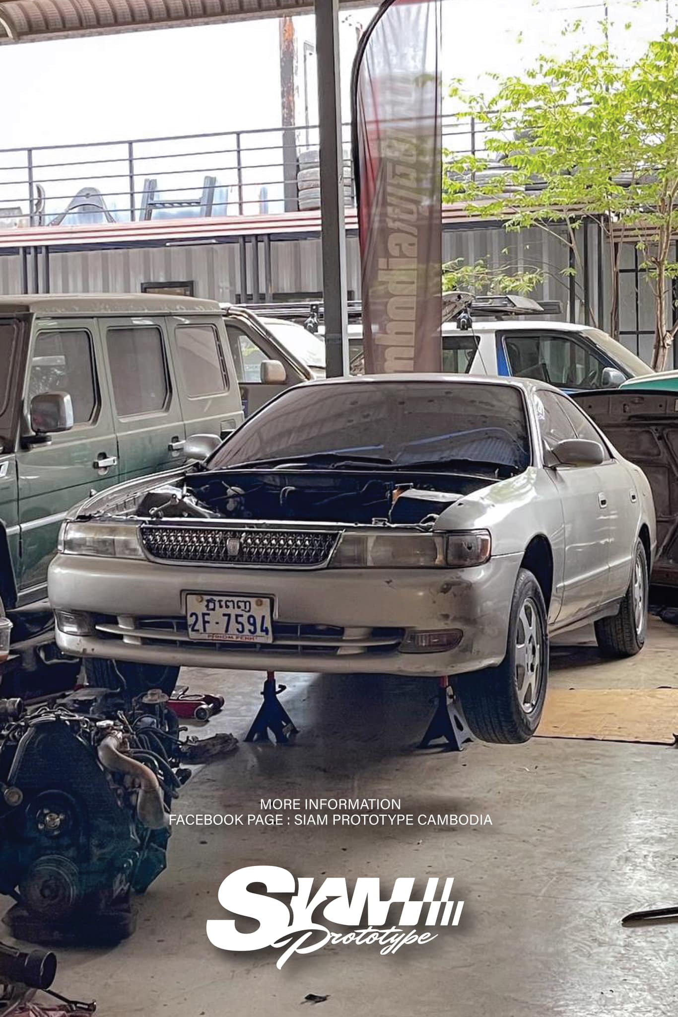 Chaser in workshop with hood up