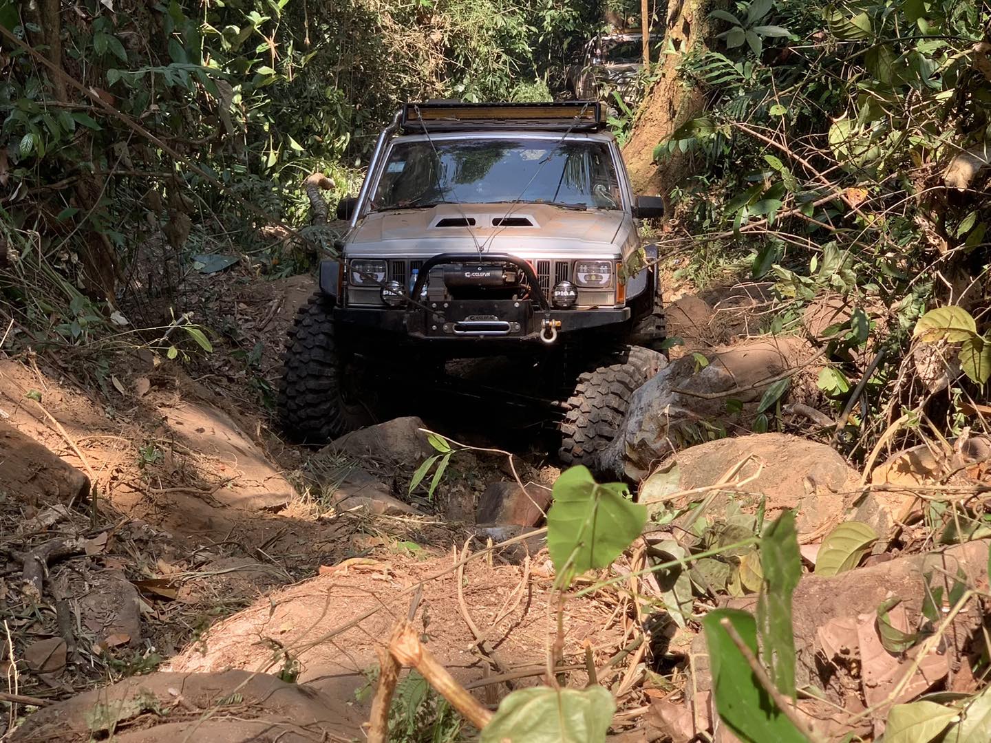 Cherokee crawling through jungle mud trail