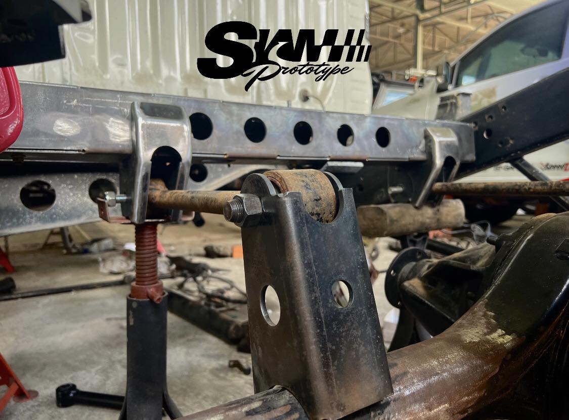 Custom bracket fabricated and welded to chassis