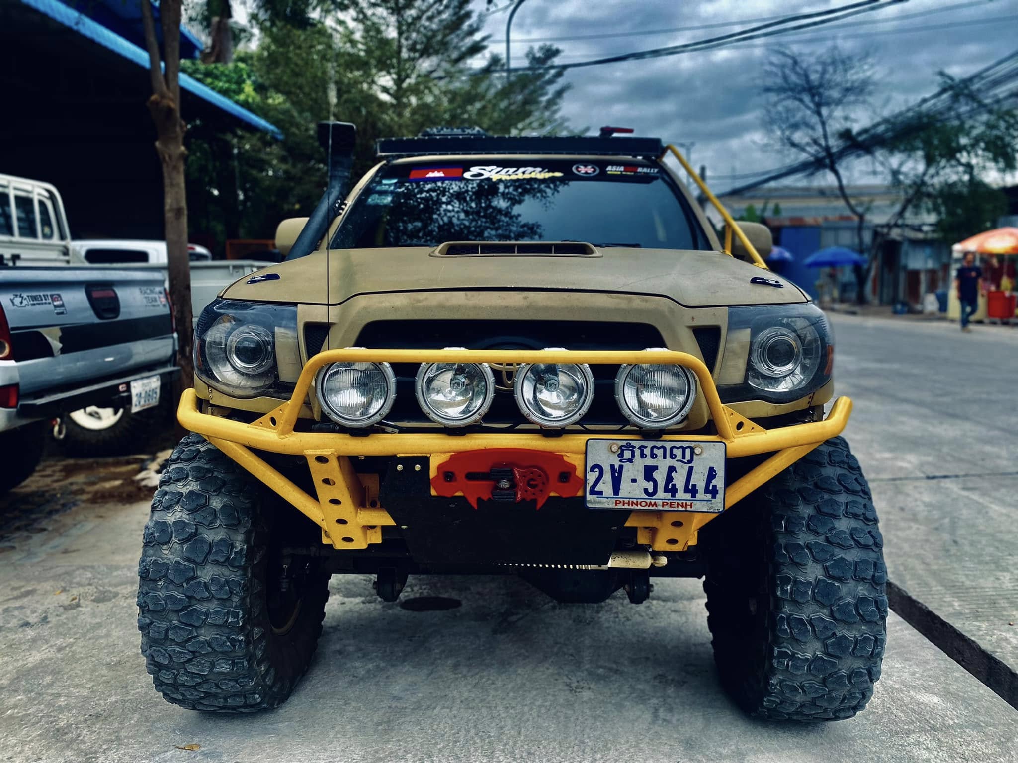 Tacoma Beast head-on with quad spotlights and WARN winch