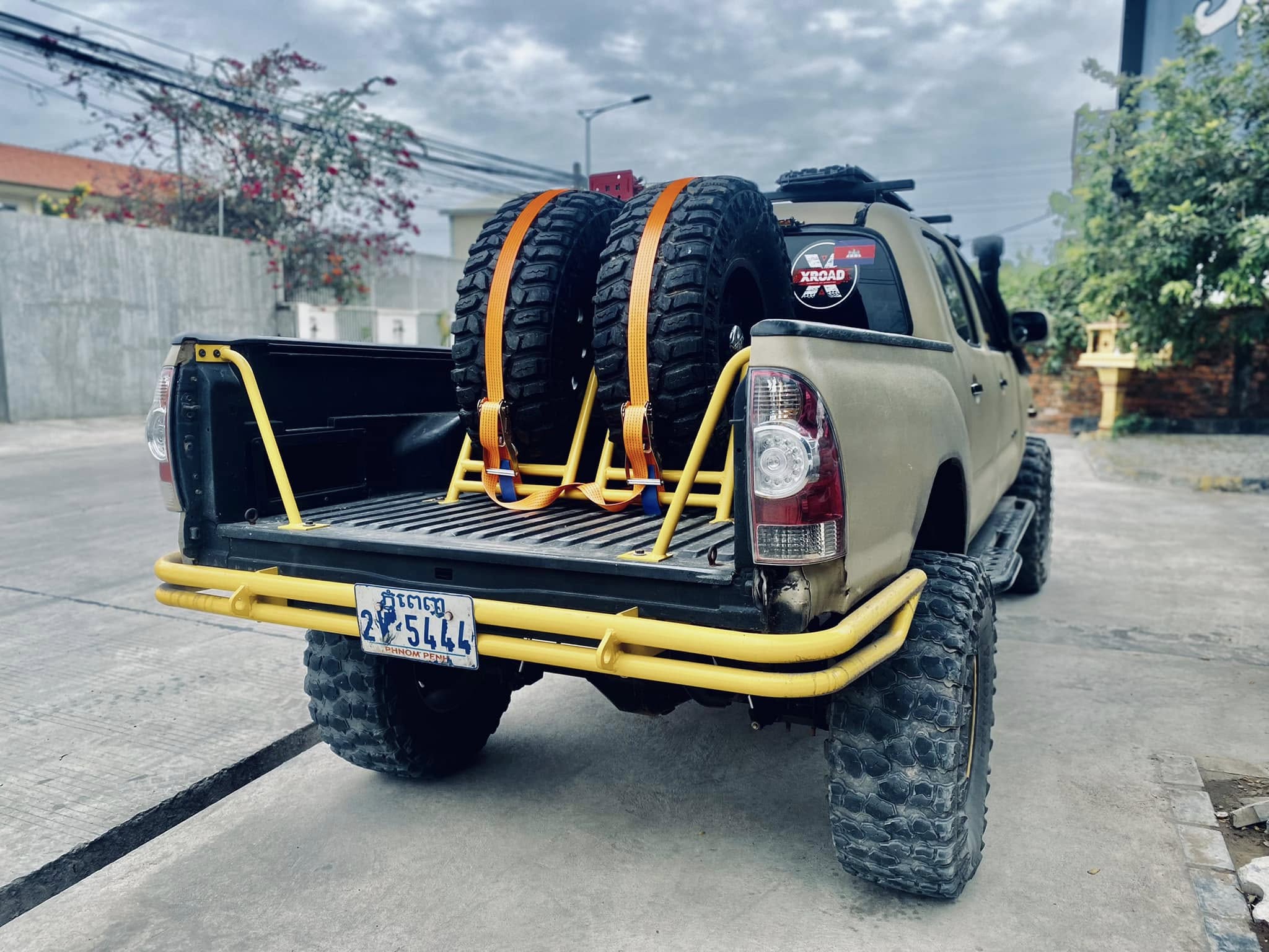 Rear with dual spare tires on custom bed rack