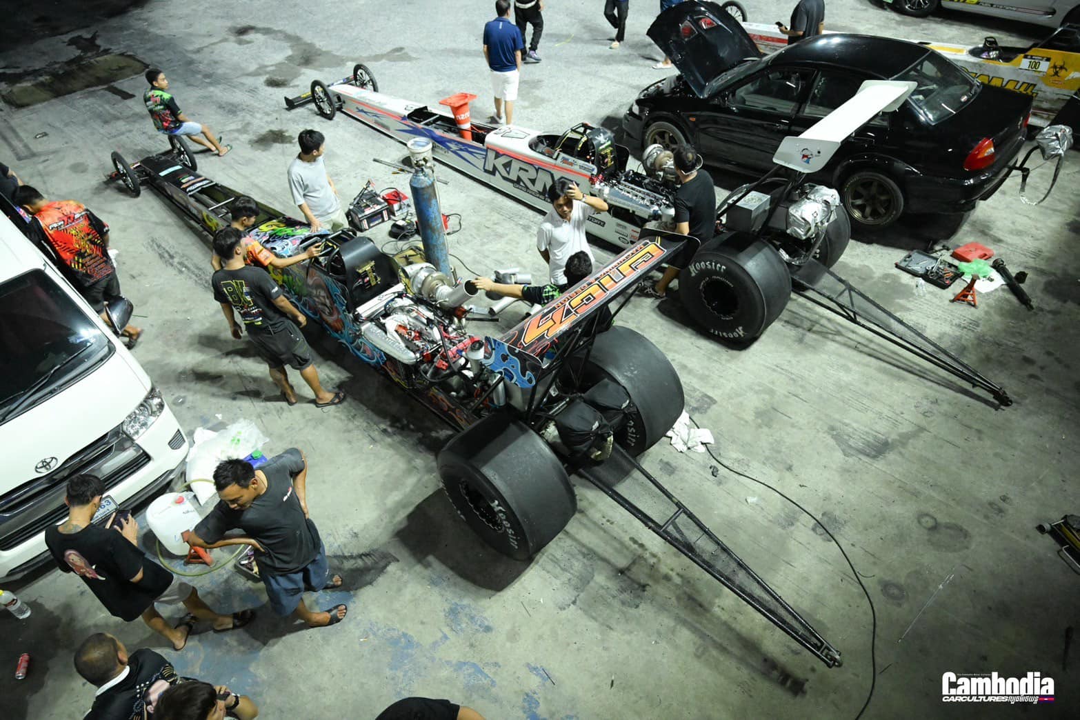 Aerial view of crew on the dragster